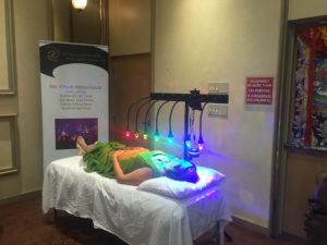 medium of person receiving photon therapy on StellarWaves crystal bed