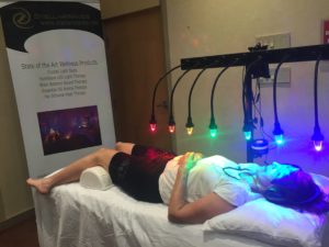person on crystal bed receiving energy healing