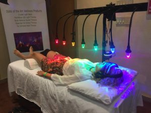 person on StellarWaves crystal bed receiving vibrational healing